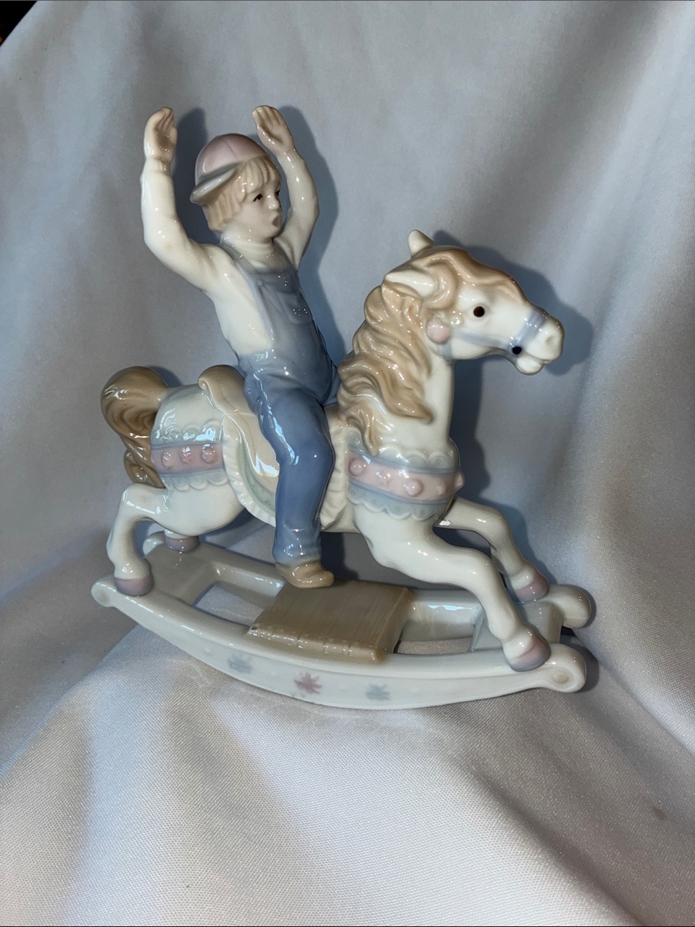 Pastel Porcelain Rocking Horse Figurine with Boy in Blue Overalls